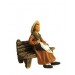 Femme à la Poule assise sur le banc